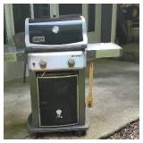 Webber gas grill with cover.