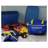 Lot of life jackets, bag has 4, tub has 5,
