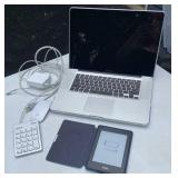 MacBook Pro with mouse and calculator and a