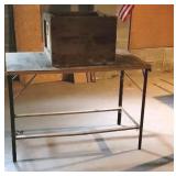 Work table with large advertising crate.