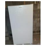 Frigidaire stand up freezer in the basement b