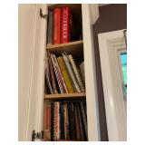 cookbooks incl Pyrex ( cupboard above sink)