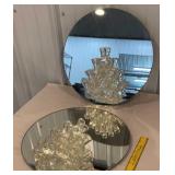 2 round mirrors with attached flower vases