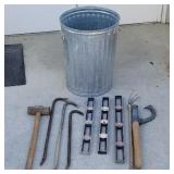 Garbage can lot of Pry bars, sledge hammer, log