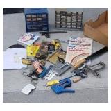 Box of misc.  Machete, staple gun, parts caddys,