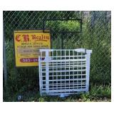 Gates and metal sign stands.