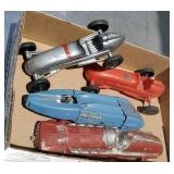 Box of four toy cars