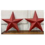 2 red metal barn stars