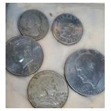 Coins - 1962 half dollar, 1976 silver dollar,