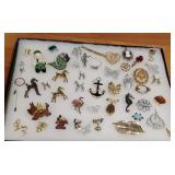 Showcase lot - mostly brooches including horses,