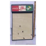 Coca-Cola advertising sign with letters and