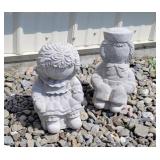 2 concrete Raggedy Ann statues