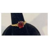 10k ring with red stone