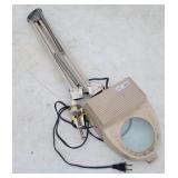 Clamp on magnifying light