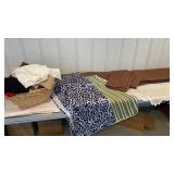 Basket of linens - curtains, comforter,