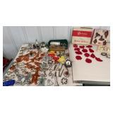 Box of retro cookie cutters, bottle openers,