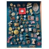 Box of pins and patches including some World