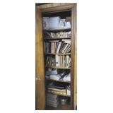 Contents of closet near bathroom - cookbooks, am