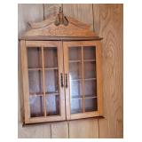 Small hanging cabinet - on front porch