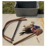 Tub lot saws, driveway markers, garden tools.