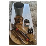Trash can full auger bits, pry bars, etc