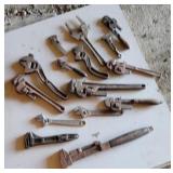 Old pipe and adjustable wrenches.