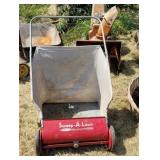 Walk behind lawn sweeper.