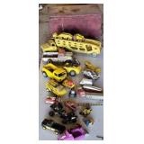 Toy box of old tin, and plastic trucks. Tonka,