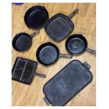 Box of cast iron cookware- 1 pan damaged