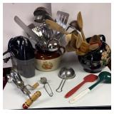 Box of kitchen utensils with crocks and an
