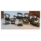 13 sad irons incl child size and trivets
