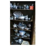 Contents of bookcase mostly silverplate