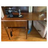 Singer sewing machine in cabinet