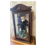 Camellia Garden porcelain doll on showcase