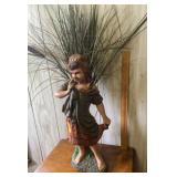 Girl statue with faux grass