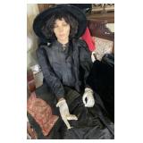 Half a mannequin in Victorian clothes - one arm