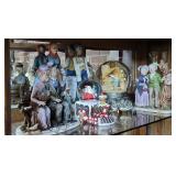 Figurines and snow globes - in china cabinet