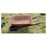 Wheel Barrow with typically flat tire. Holds