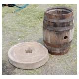 Grinding stone, and nail keg.