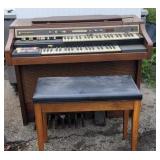 Hammond organ and stool.