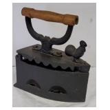 Rooster coal sad iron