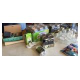 2 Boxes of brand new mason jars and lids and a