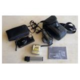 2 35mm camera and a PocketDV 3100 with tripod