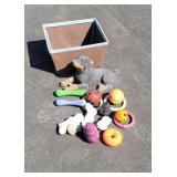 Dog toys, basket, concrete dog.