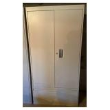 White 2 door metal cabinet with keys