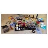 Grey tub of miscellaneous office supplies, tools,