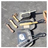 Hatchets and dust brooms and dust pans.