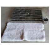 42x28 dog crate with pad and water bucket.