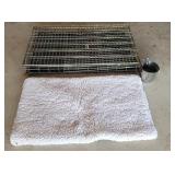 Another 44x22 dog crate with water bucket.