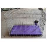 42x20x30 Dog crate with water bucket and pad.